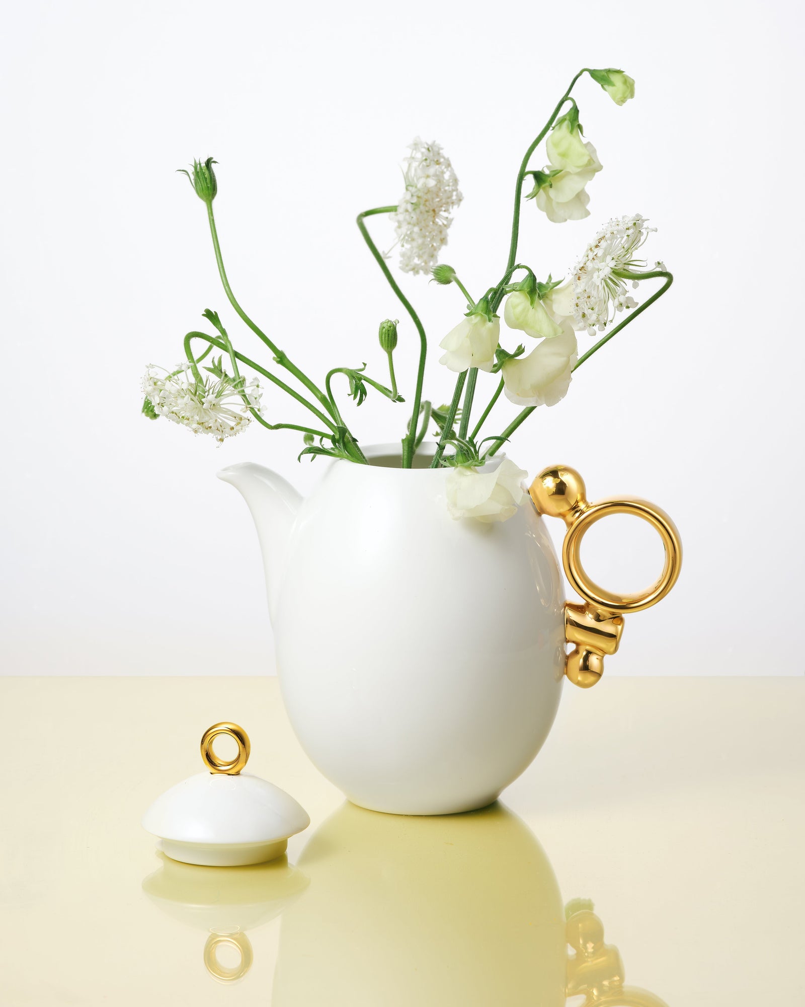 Prouna Geometrica Teapot with Gold Rim White Background Photo