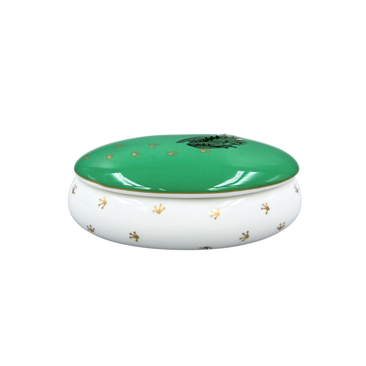 Green and white ceramic dish with gold accents on a white background